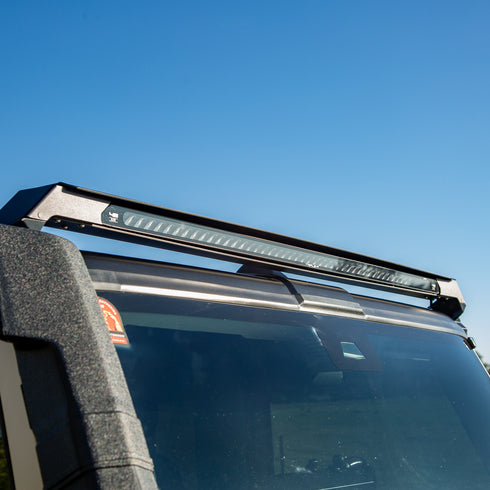 Slim LED lite bar on an Ineos Grenadier with clear blue sky