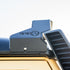Close-up of a Low Profile LED Lite bar mount on the Roof of an Inoes Grenadier, showing the detail of the cutout to allow for the snorkel to be fitted together with the RRE logo on a Sky background