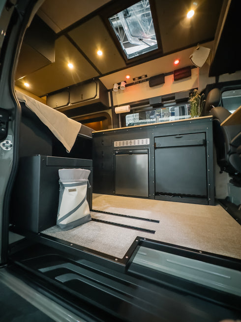 Heavy-duty aluminum Smartfloor single seat mounting plate in Sprinter Van RV build.
