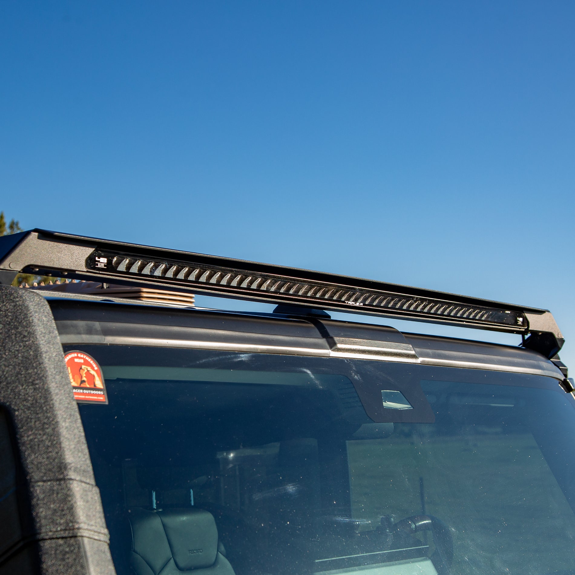 LED lite bar on an Ineos Grenadier with a clear blue sky background