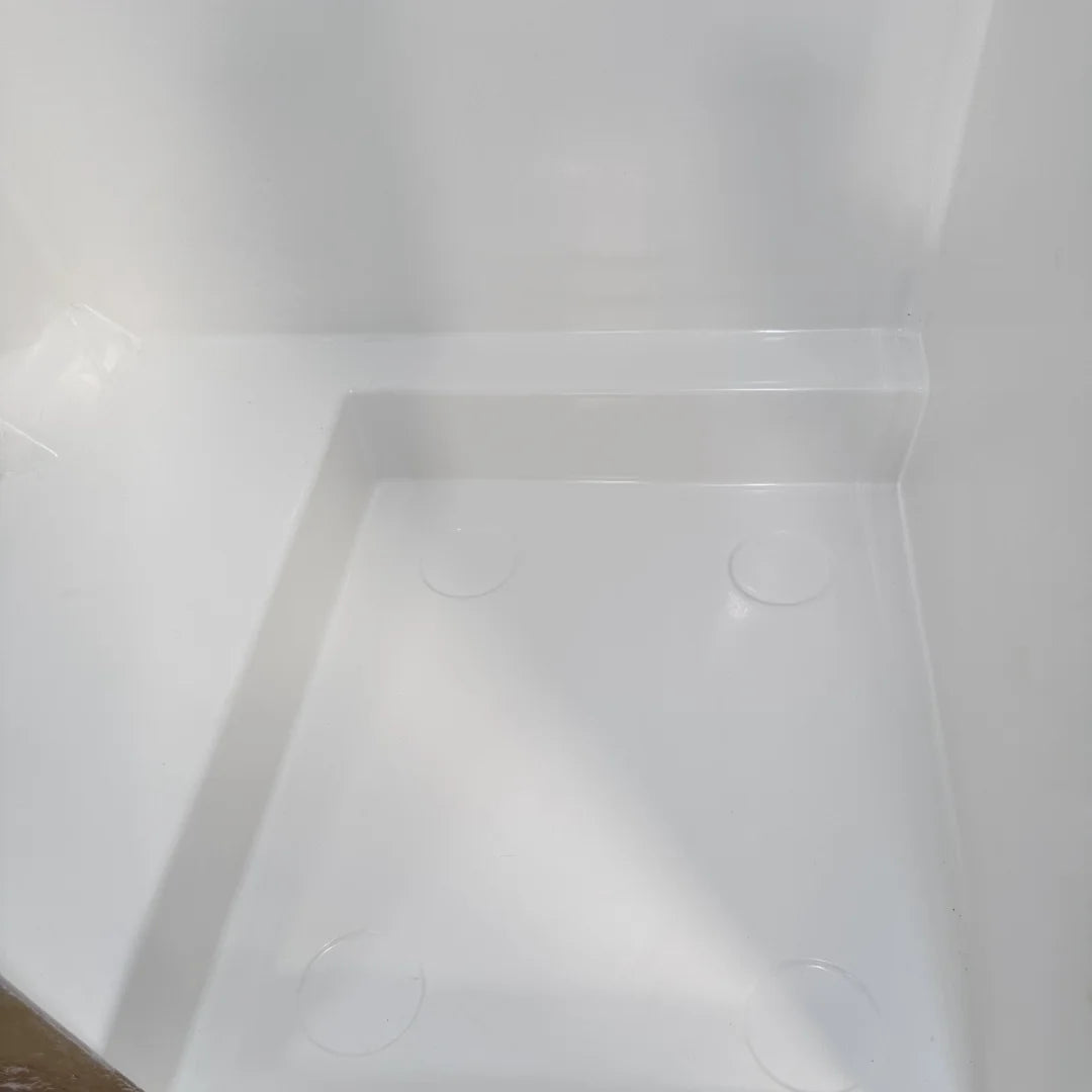High-quality FRP camper van shower booth with a gel-coat finish, contoured to fit the interior wall of a Mercedes Sprinter or Ford Transit.