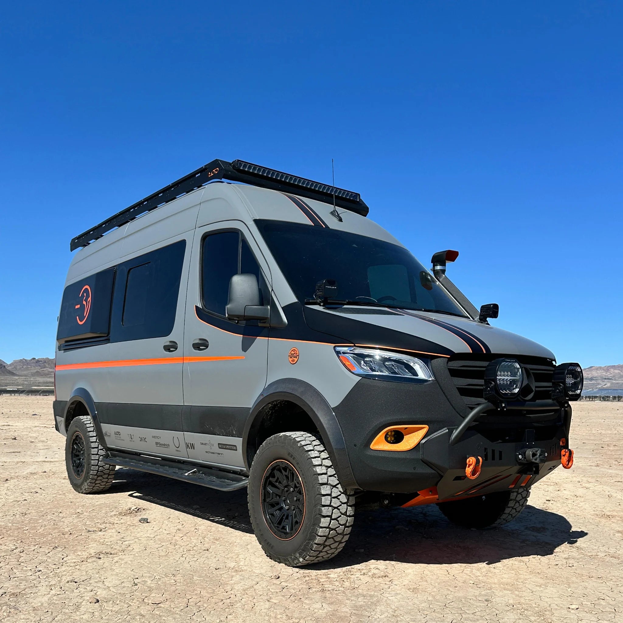 Fully insulated GRP window flares for a Mercedes Sprinter van, designed to create a 77-inch wide interior sleeping area.
