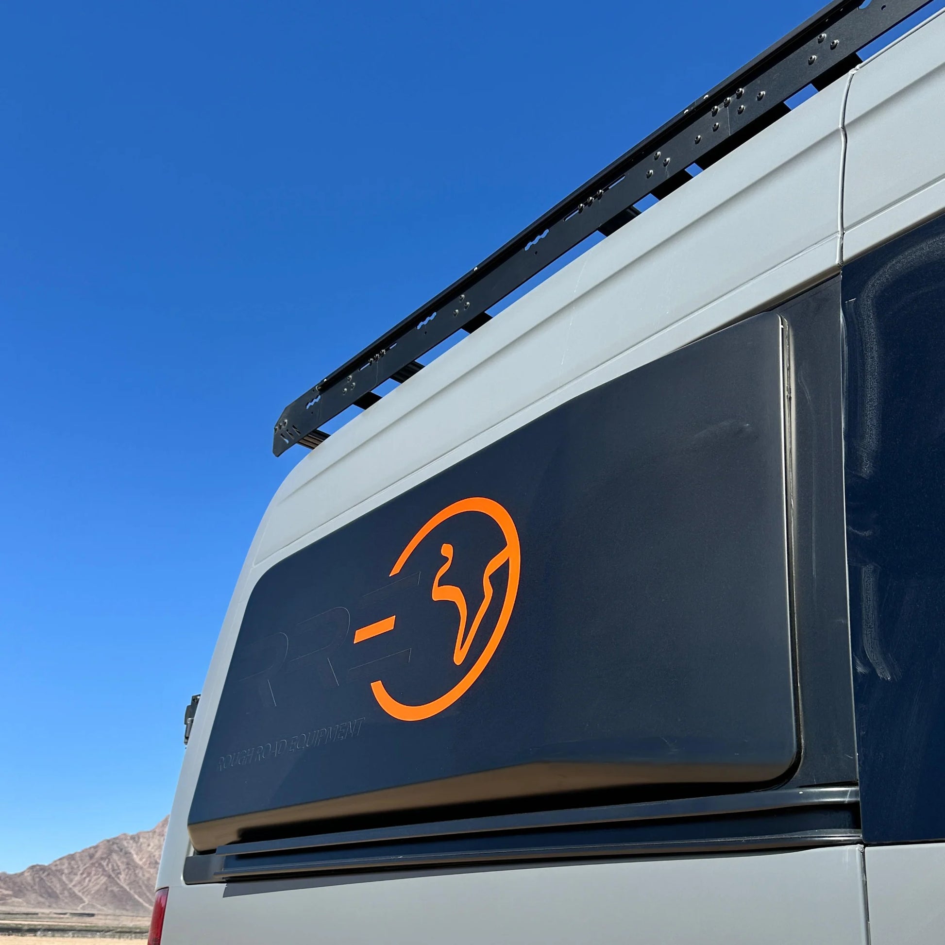 Fully insulated GRP window flares for a Mercedes Sprinter van, designed to create a 77-inch wide interior sleeping area.