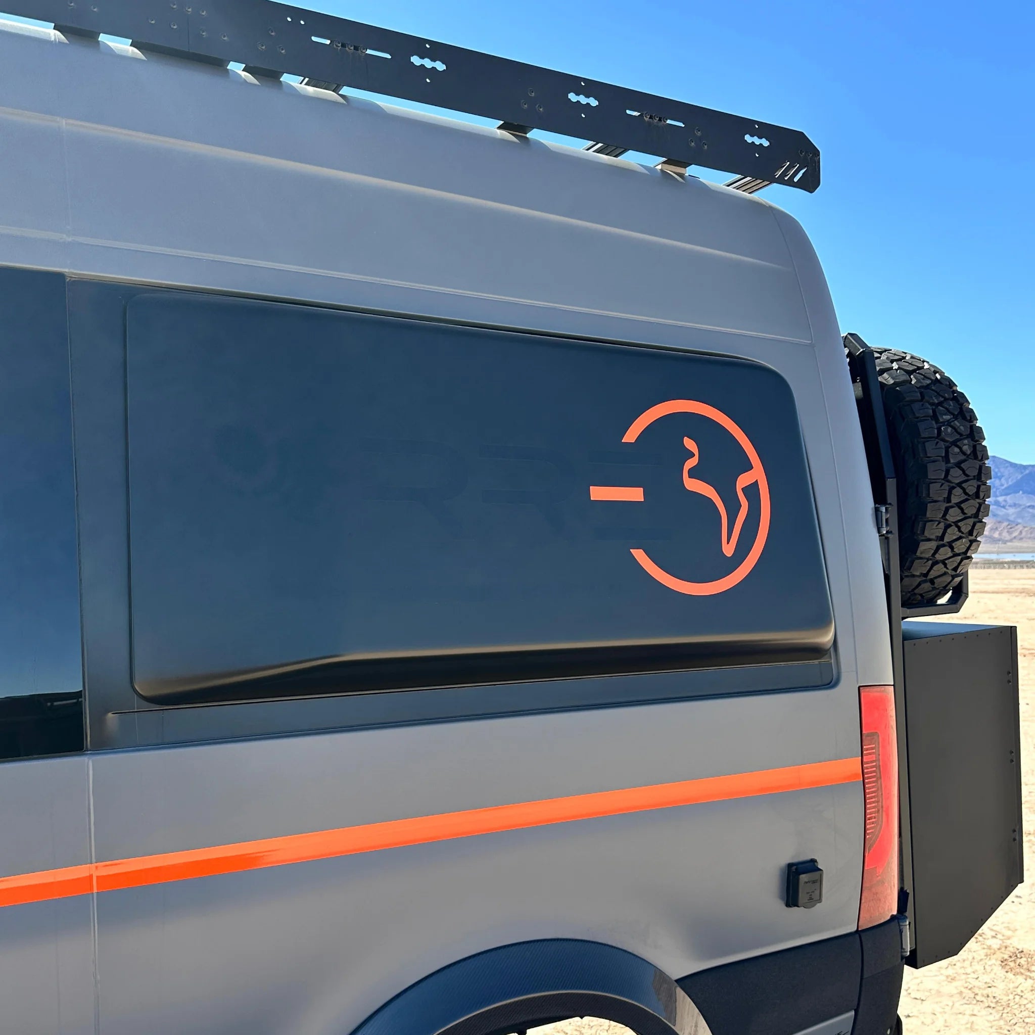 Fully insulated GRP window flares for a Mercedes Sprinter van, designed to create a 77-inch wide interior sleeping area.