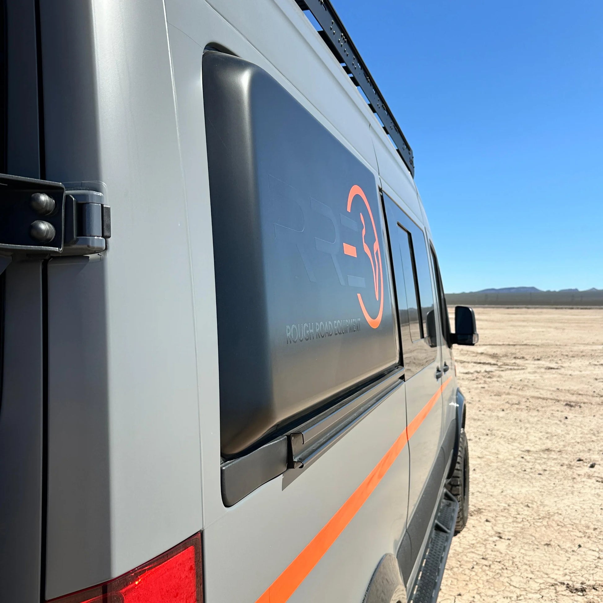 Fully insulated GRP window flares for a Mercedes Sprinter van, designed to create a 77-inch wide interior sleeping area.