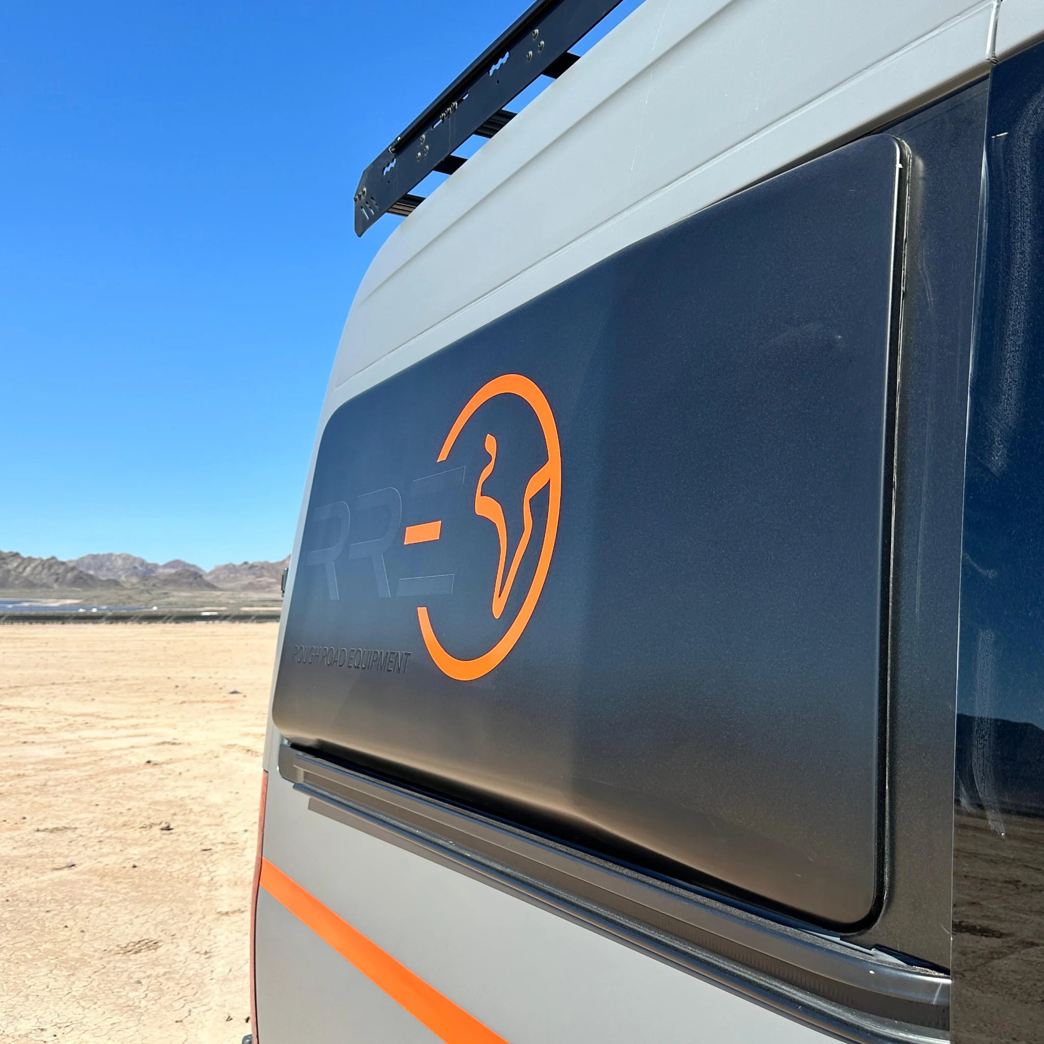 Fully insulated GRP window flares for a Mercedes Sprinter van, designed to create a 77-inch wide interior sleeping area.