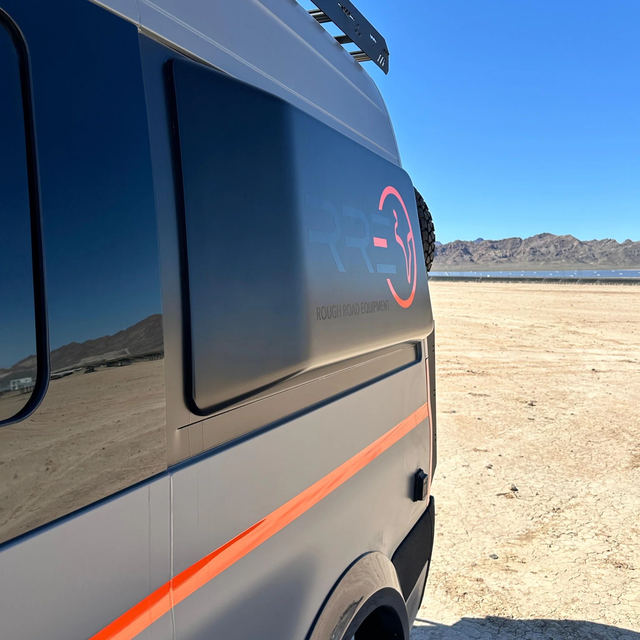 Fully insulated GRP window flares for a Mercedes Sprinter van, designed to create a 77-inch wide interior sleeping area.