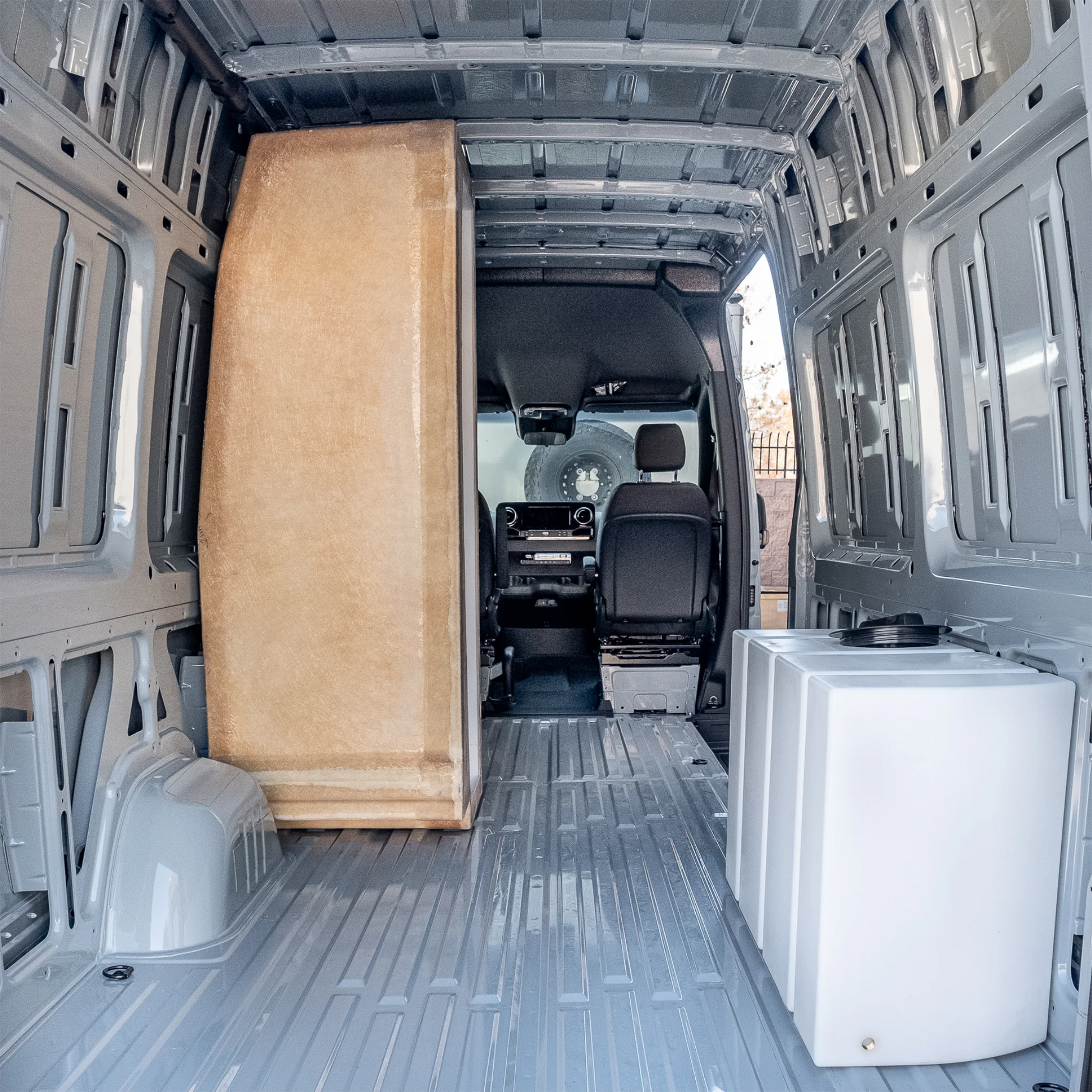 High-quality FRP camper van shower booth with a gel-coat finish, contoured to fit the interior wall of a Mercedes Sprinter or Ford Transit.