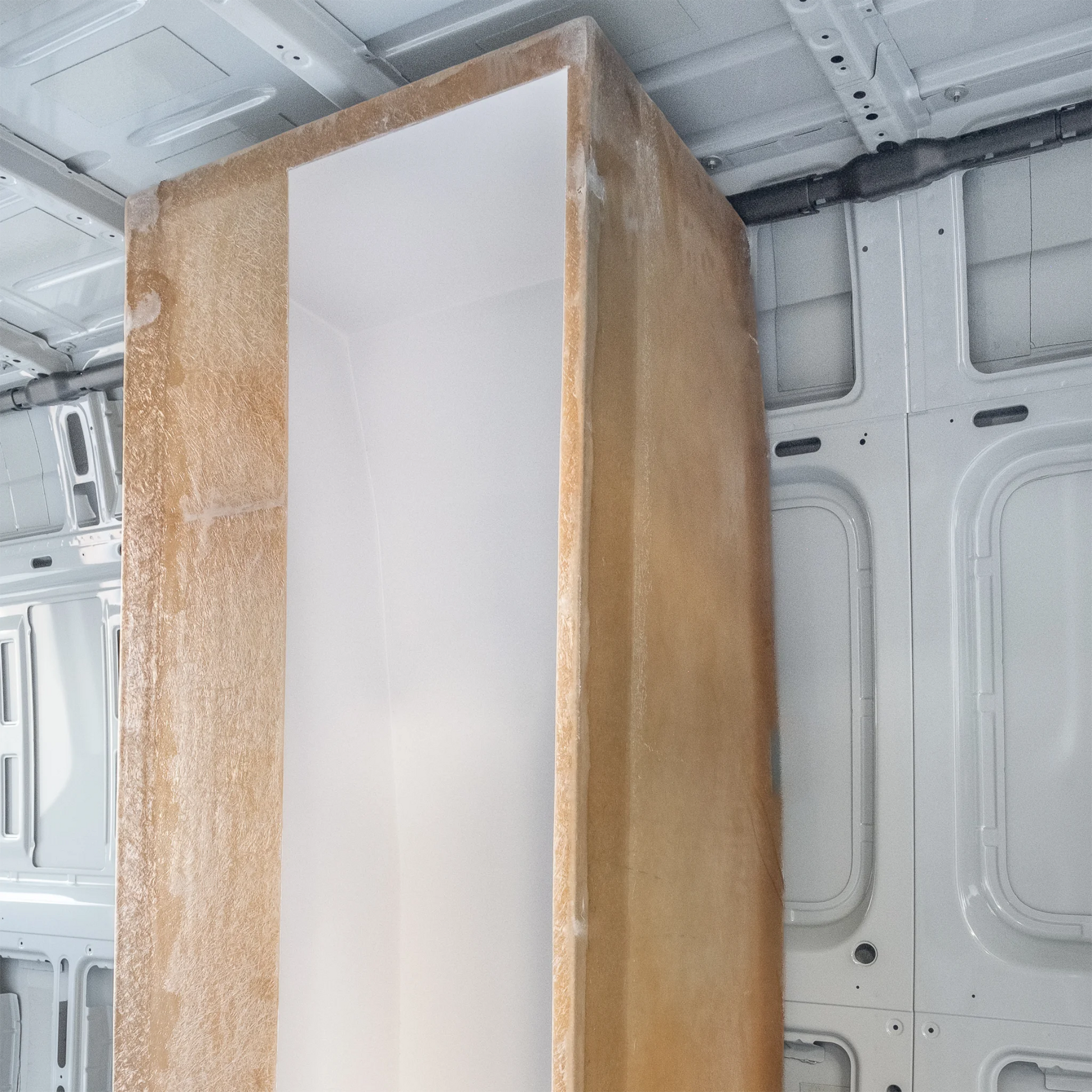 High-quality FRP camper van shower booth with a gel-coat finish, contoured to fit the interior wall of a Mercedes Sprinter or Ford Transit.