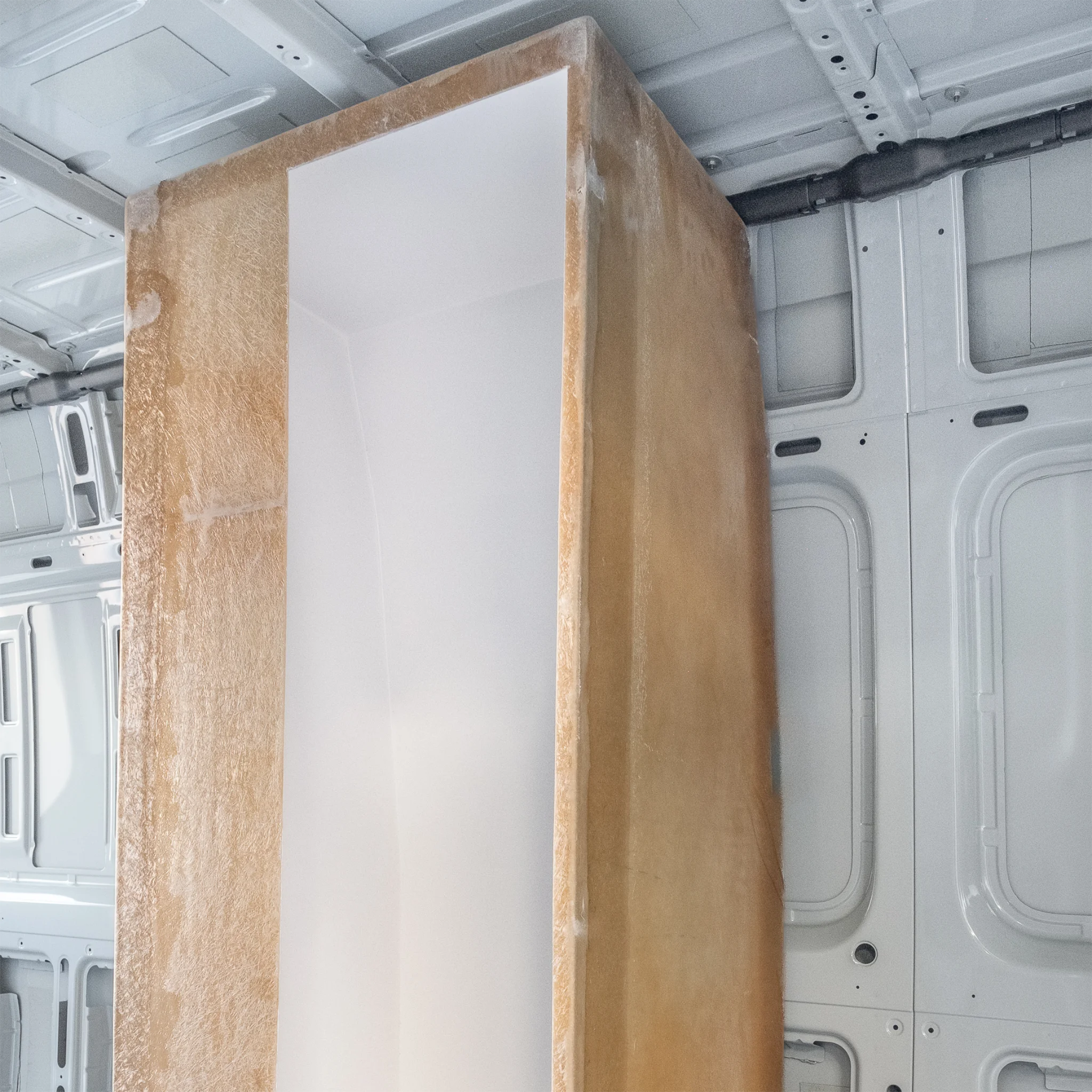 High-quality FRP camper van shower booth with a gel-coat finish, contoured to fit the interior wall of a Mercedes Sprinter or Ford Transit.