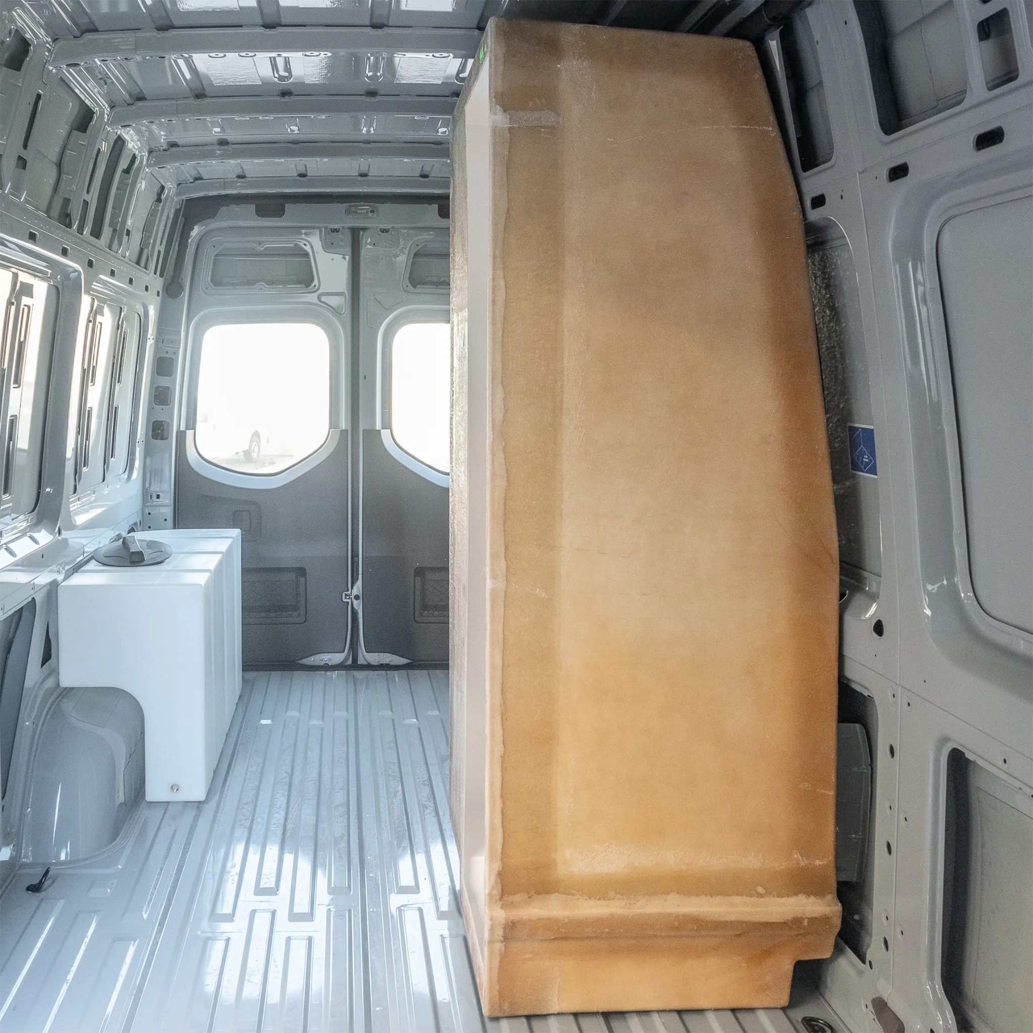 High-quality FRP camper van shower booth with a gel-coat finish, contoured to fit the interior wall of a Mercedes Sprinter or Ford Transit.