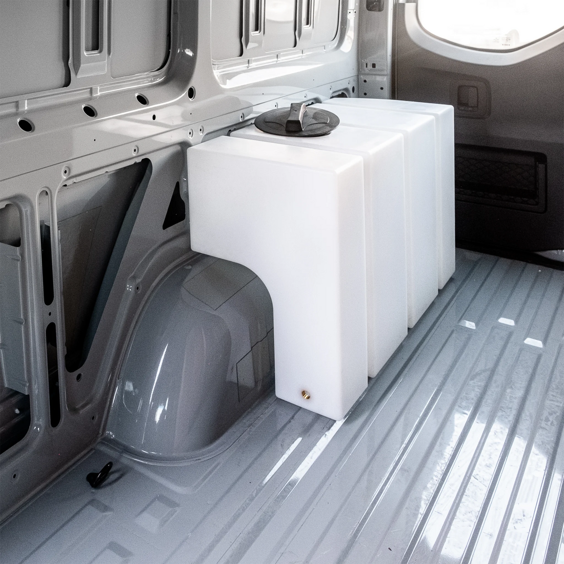 Heavy-duty 59.4 gallon poly wheel well fresh water tank with brass fittings, contoured for Mercedes Sprinter 144 and 170 wheelbase.